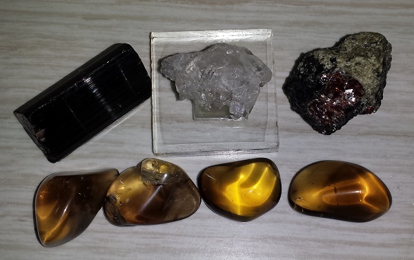 Tourmaline, Obsidian, Quartz, and Garnet on Amphibolite