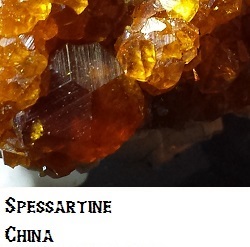 Spessartine Crystals on Microline